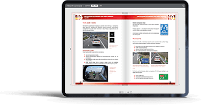 iPad z wyświetloną aplikacją do e-learningu teorii jazdy po polsku.
